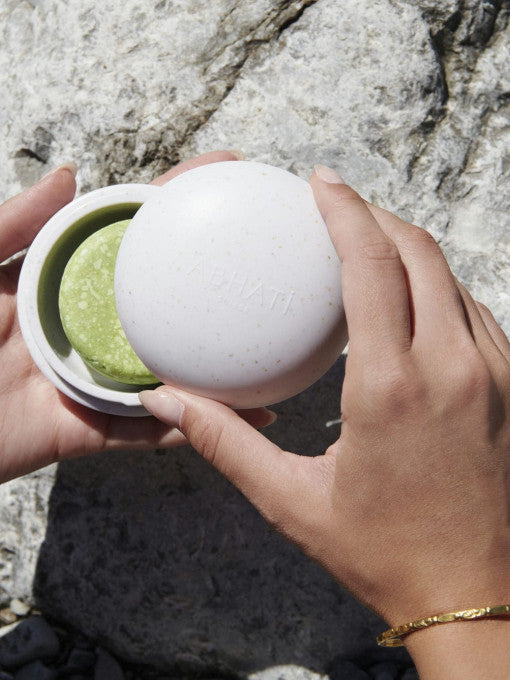 The Pebble Shampoo Bar Holder in use