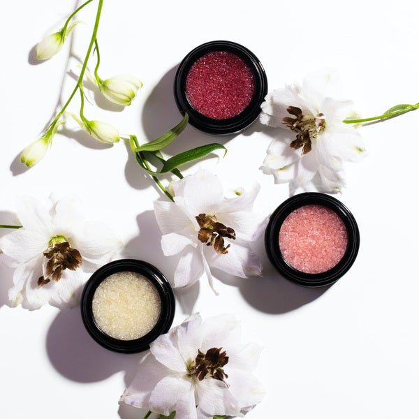 Henné Organics Lip Exfoliator - open jars and flowers