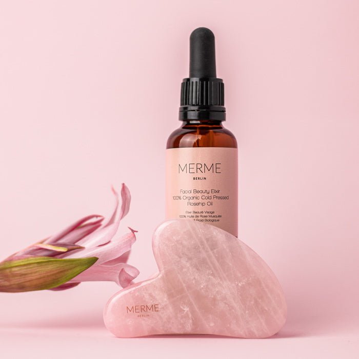 Merme Berlin Rose Quartz Gua Sha and Facial Beauty Elixir and flower